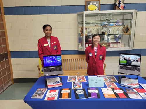 Mariyana Lords, left, of Westford and Remynisce Carrillo of Chelmsford represent the SkillsUSA club during the annual Open House at Nashoba Valley Technical High School on November 2. Mariyana is the State Historian of the Massachusetts chapter of SkillsUSA.