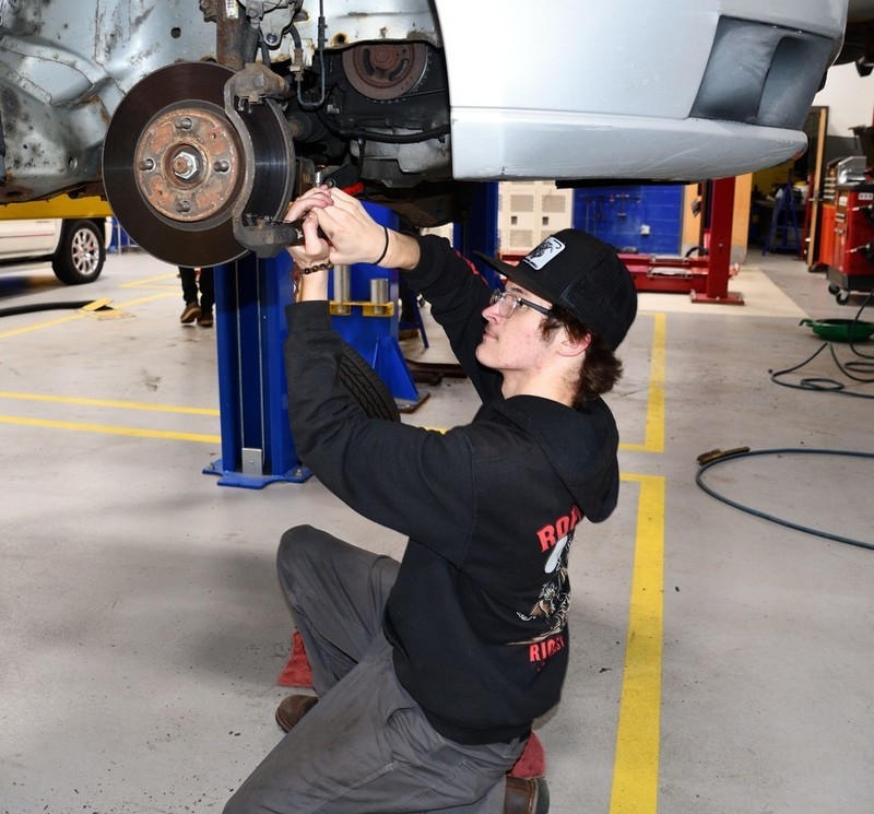 Sophomore Logan Walsh (Townsend) is ready to change and rotate your tires. Call Nashoba Tech’s Automotive Technology program at 978-692-4711, ext. 13111 or 13112. (COURTESY NASHOBA TECH)