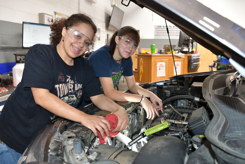 Sophomores Mya-Lynn Rivera (Westford), left, and Olivia Gary (Chelmsford) can check under your car’s hood and make any repairs needed. Call Nashoba Tech’s Automotive Technology program at 978-692-4711, ext. 13111 or 13112. (COURTESY NASHOBA TECH)