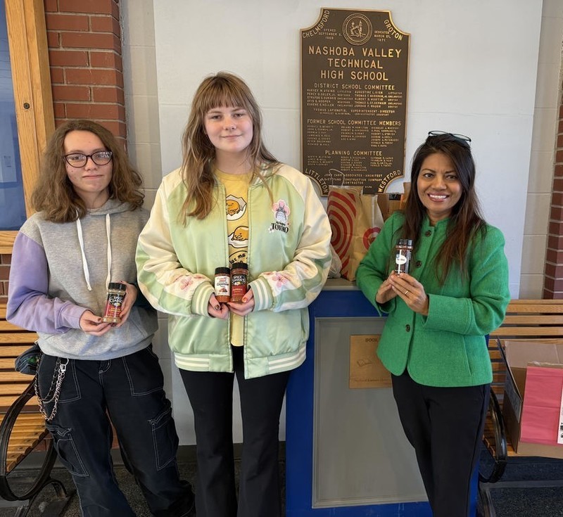 State Rep. Vanna Howard, a member of the CBA Board of Directors, accepted the donation from club members Emma Ehring (senior, Chelmsford), left, and Aaron Jewer-Liles (senior, Chelmsford).