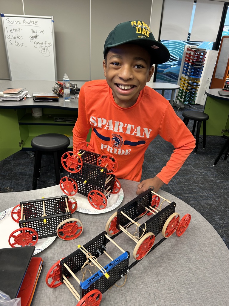 Student showing off his model car!