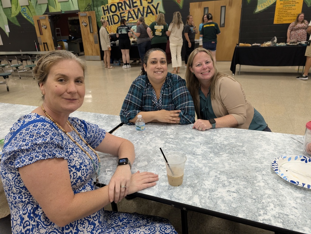 Three teachers sitting down enjoying time together