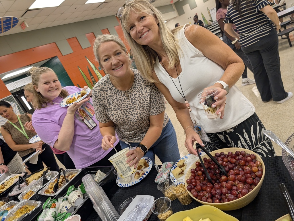Three teachers enjoying their breakfast