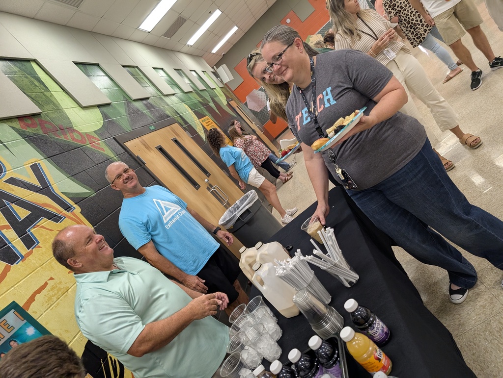 Exchange church members serving teachers coffee