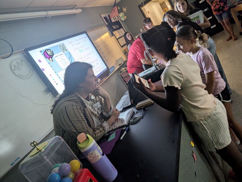 Teacher speaking with students