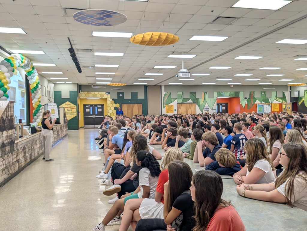 Students all paying attention to a grade level meeting about school expectations