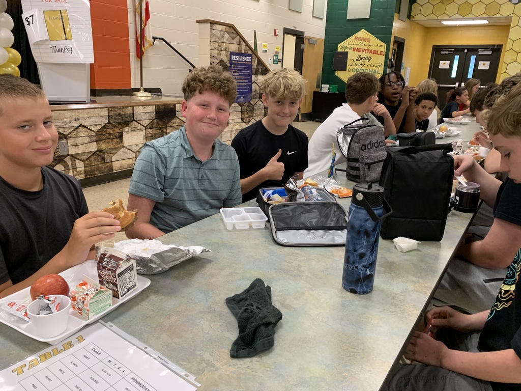 Students smiling at lunch