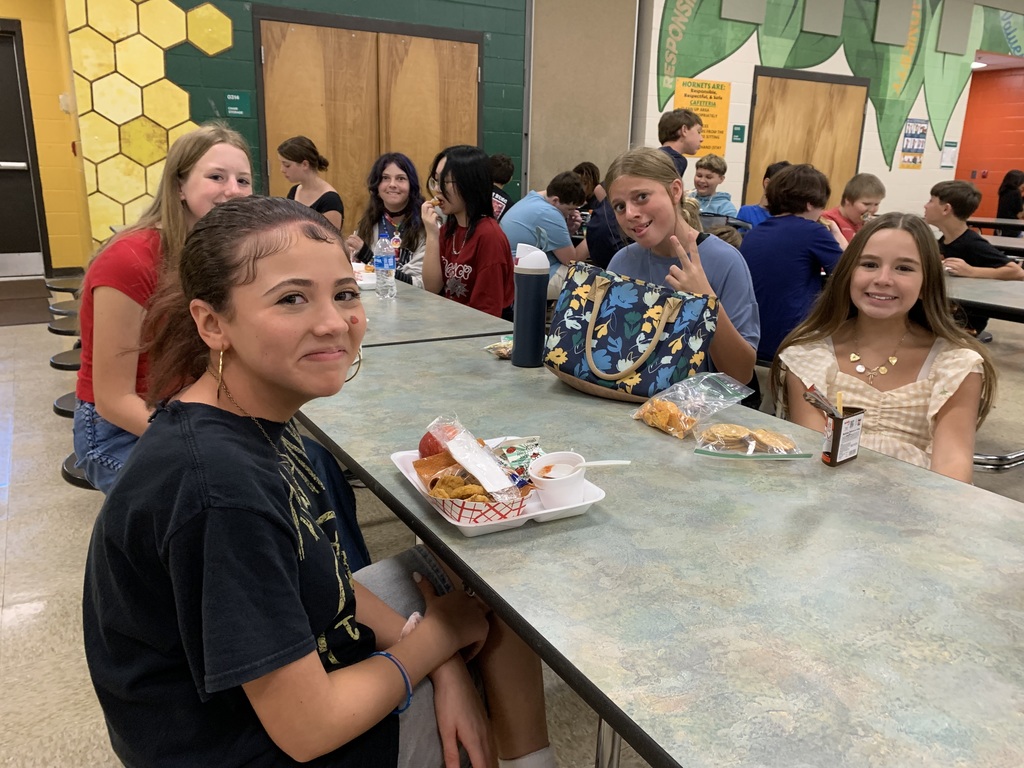 Students smiling at lunch