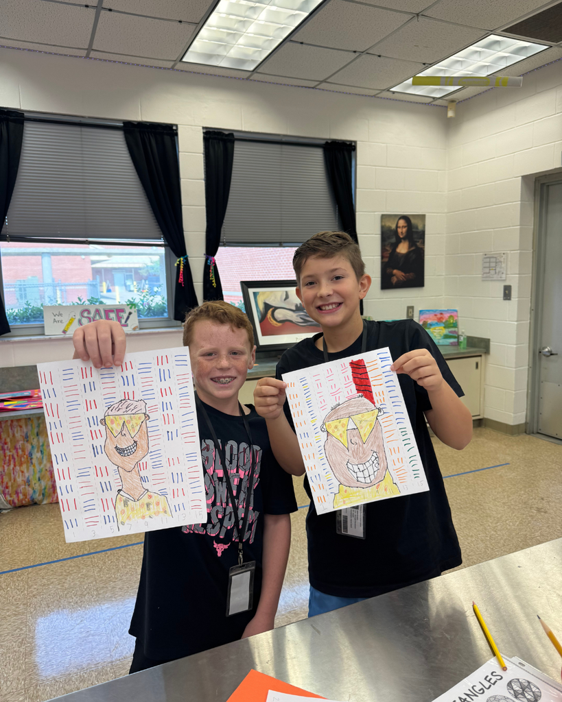 Two students stand side by side holding their Op Art agamograph projects—self-portraits with pizza-slice sunglasses, surrounded by patterned line backgrounds.