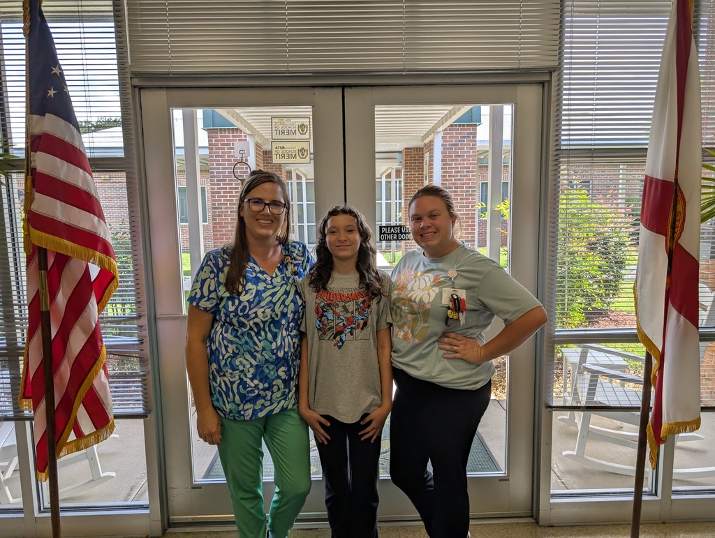 School Nurses smiling with student