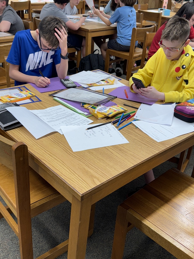 Students working on math in the media center