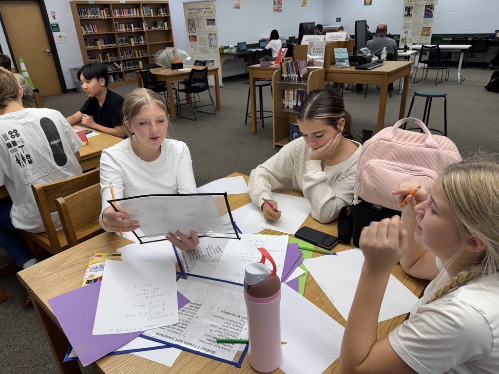 Students working on math in the media center