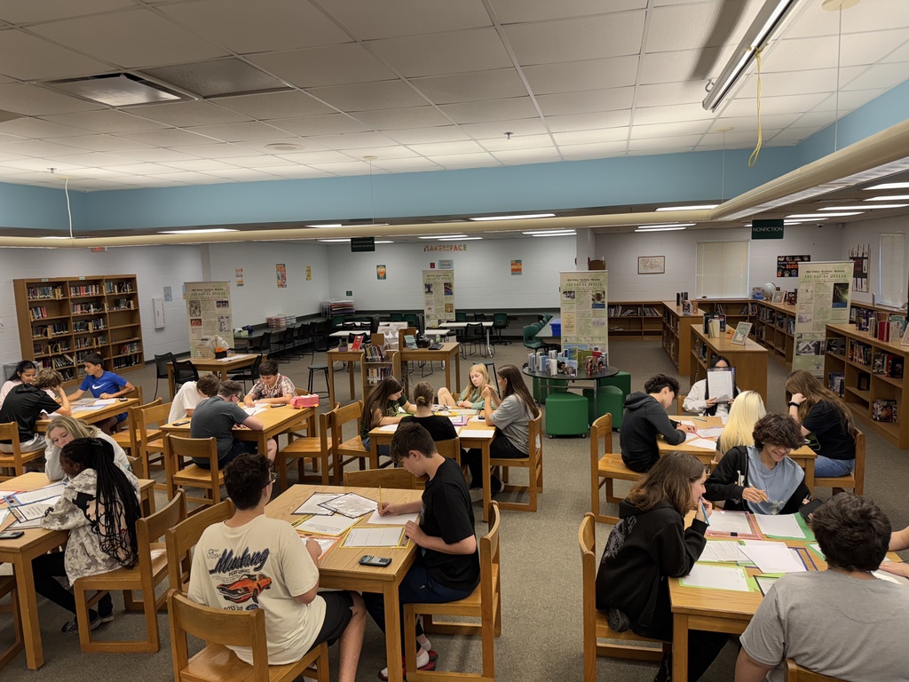 Students working on math in the media center