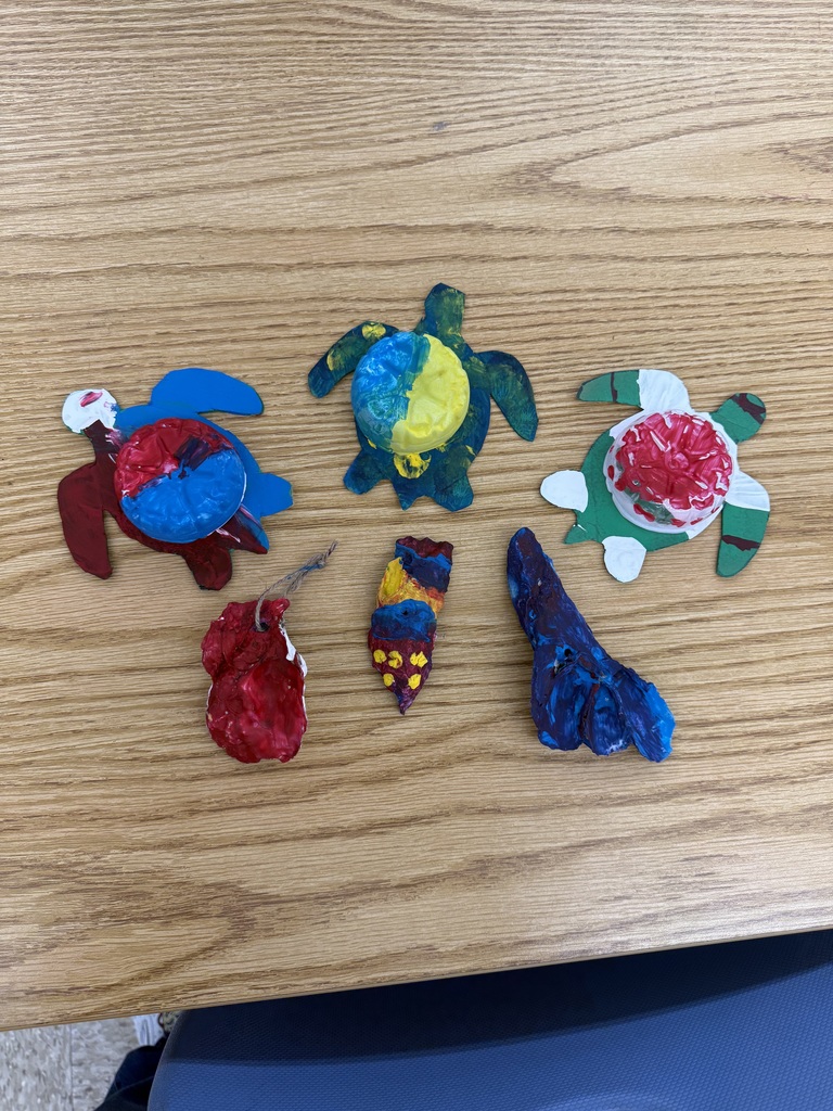 Painted oyster shells and turtles made from recycled bottles.