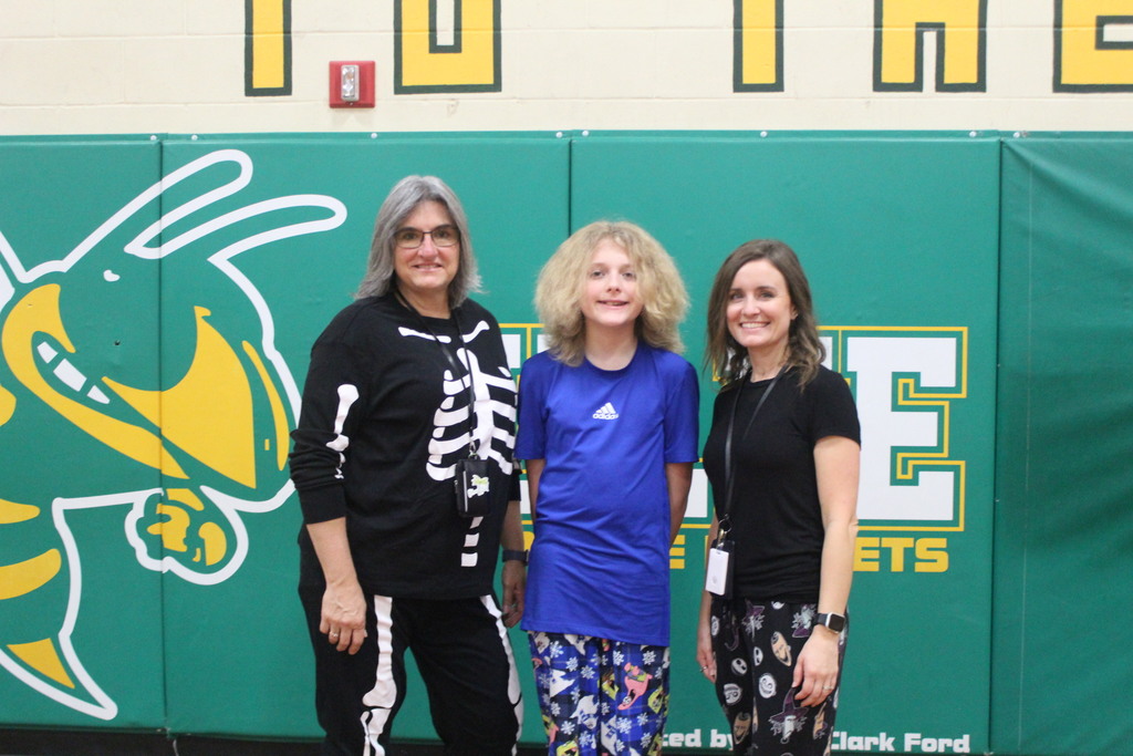 Students and Teachers posing in PJs