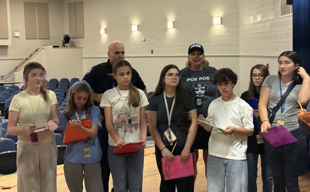 Officer Passante and Mrs. Morgan with students.