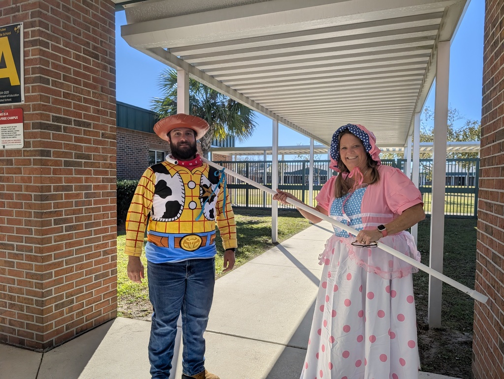 Administrators dressed as characters from Toy STory