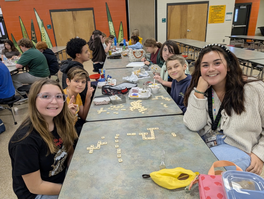Ms. Alvare playing Scrabble with her students at lunch