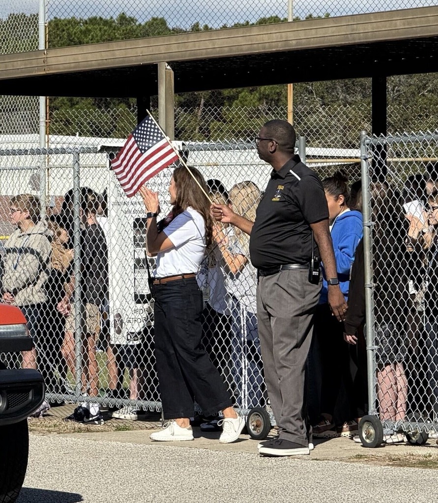 Dr. Crawford and Mr. Hardy cheering the veterans.