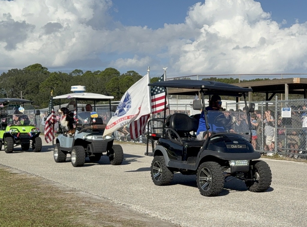 Veterans on golf carts.