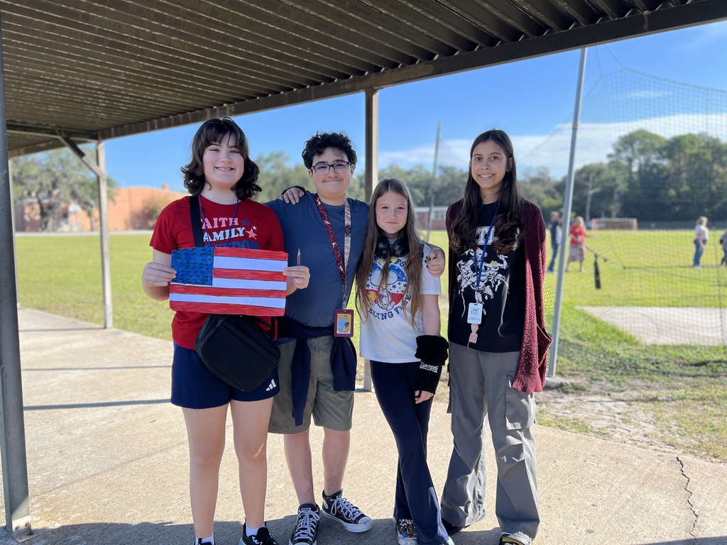 Group of students with a painted flag.