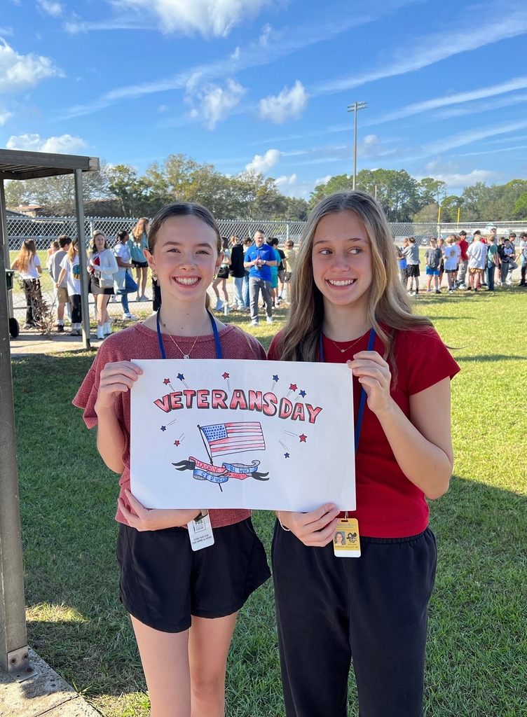 Students holding a sign