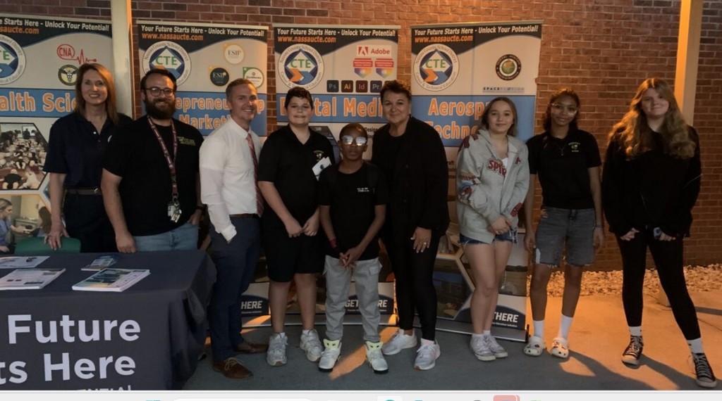 Students posed with staff at the steam event