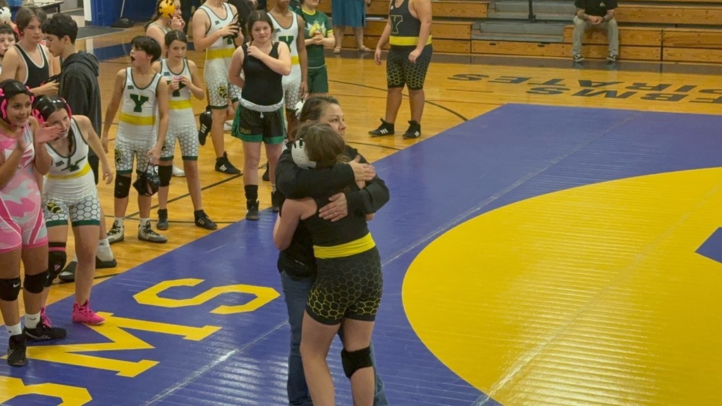 Student gets a big hug after a great match 