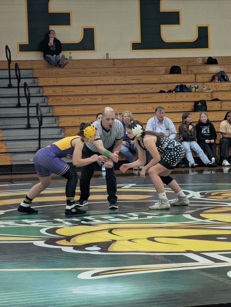 Two students get ready to face off on the mat