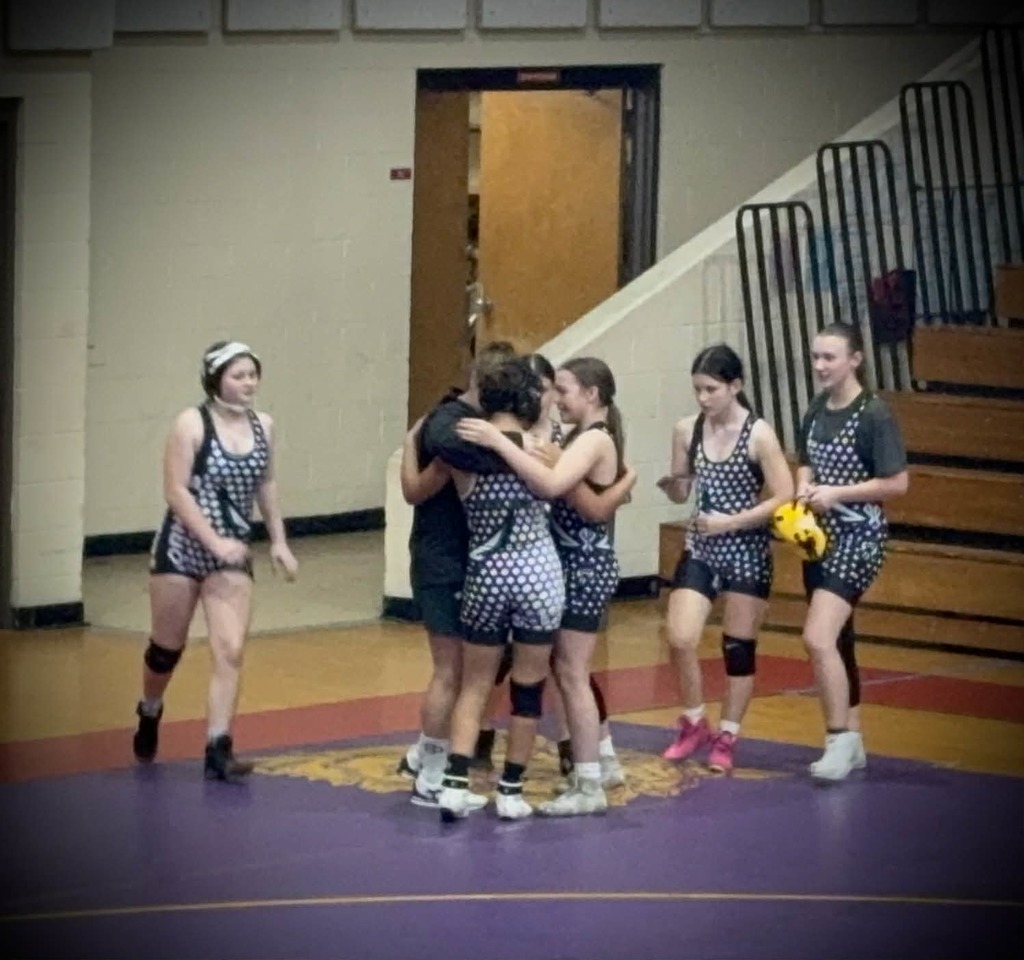 Wrestlers celebrate together