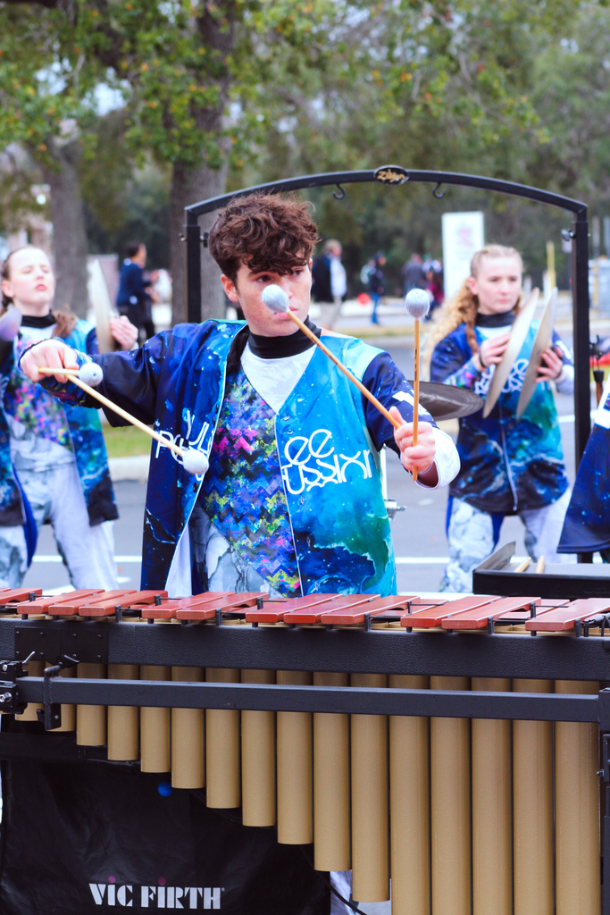 Yulee High School percussionist plays a vibraphone with mallets during competition.