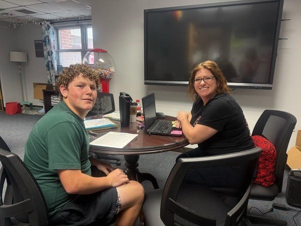 Student working with Career Shadow Employee