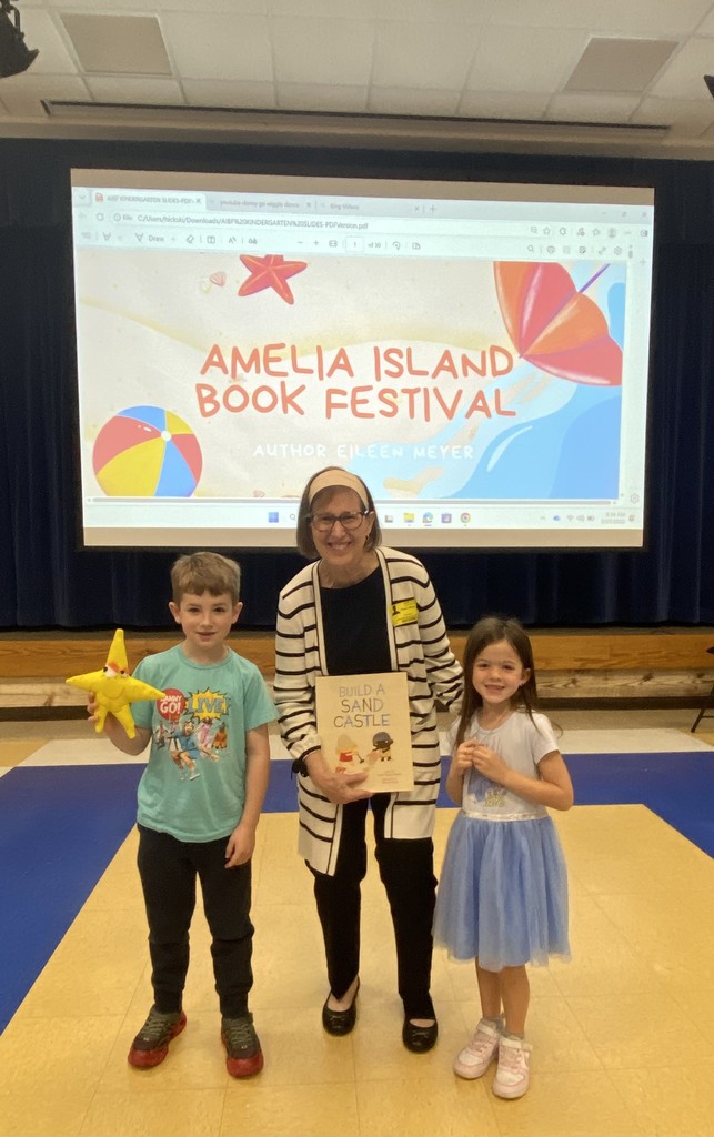 Author Eileen Meyer poses with two Southside Elementary School students as part of the Amelia Island Book Festival's Authors In School