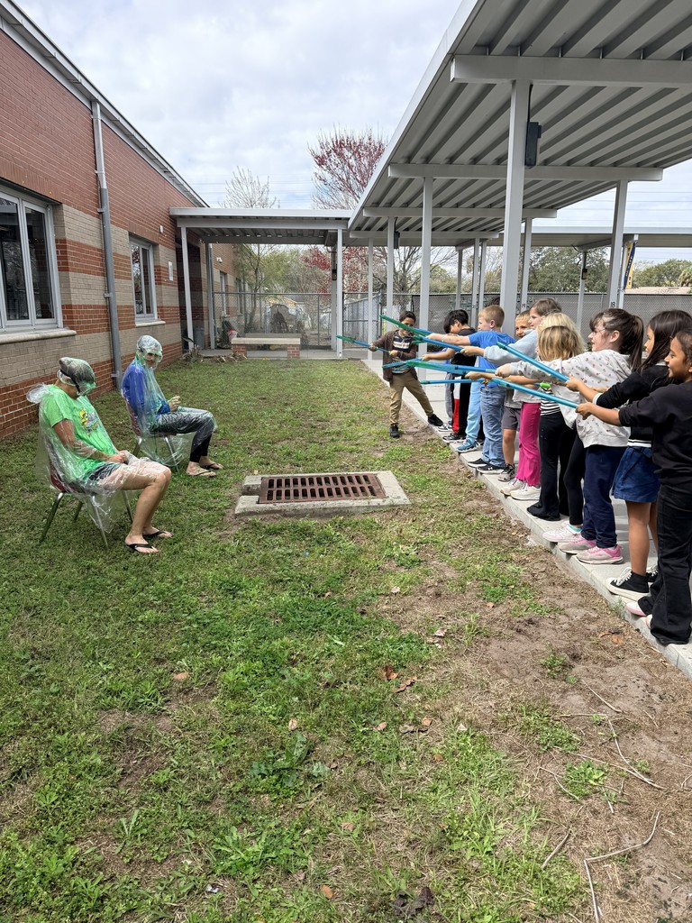 Class squirting slime at Dr. Weber and Ms. Trammell.