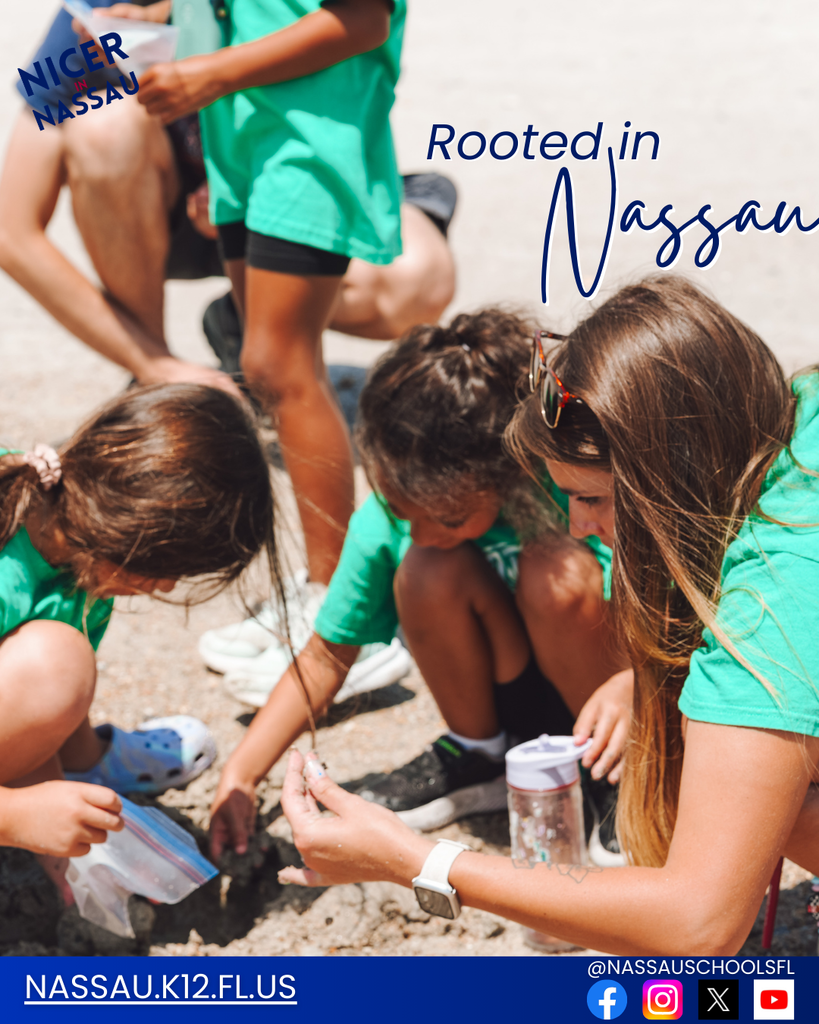 An elementary teacher kneels with several students outdoors as they examine a small object together during a hands-on learning activity. Text on the image reads “Rooted in Nassau,” with the Nassau County School District website and social media icons displayed at the bottom.