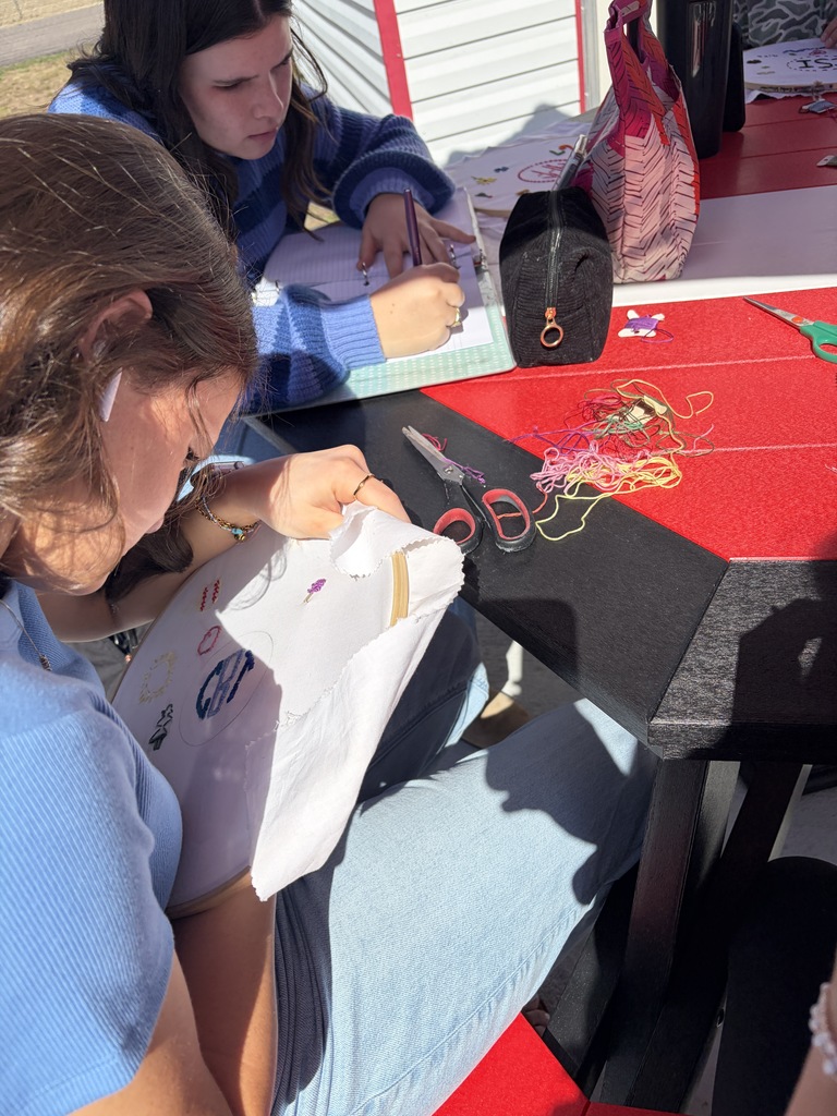 Student working on a hand embroidery memory project.