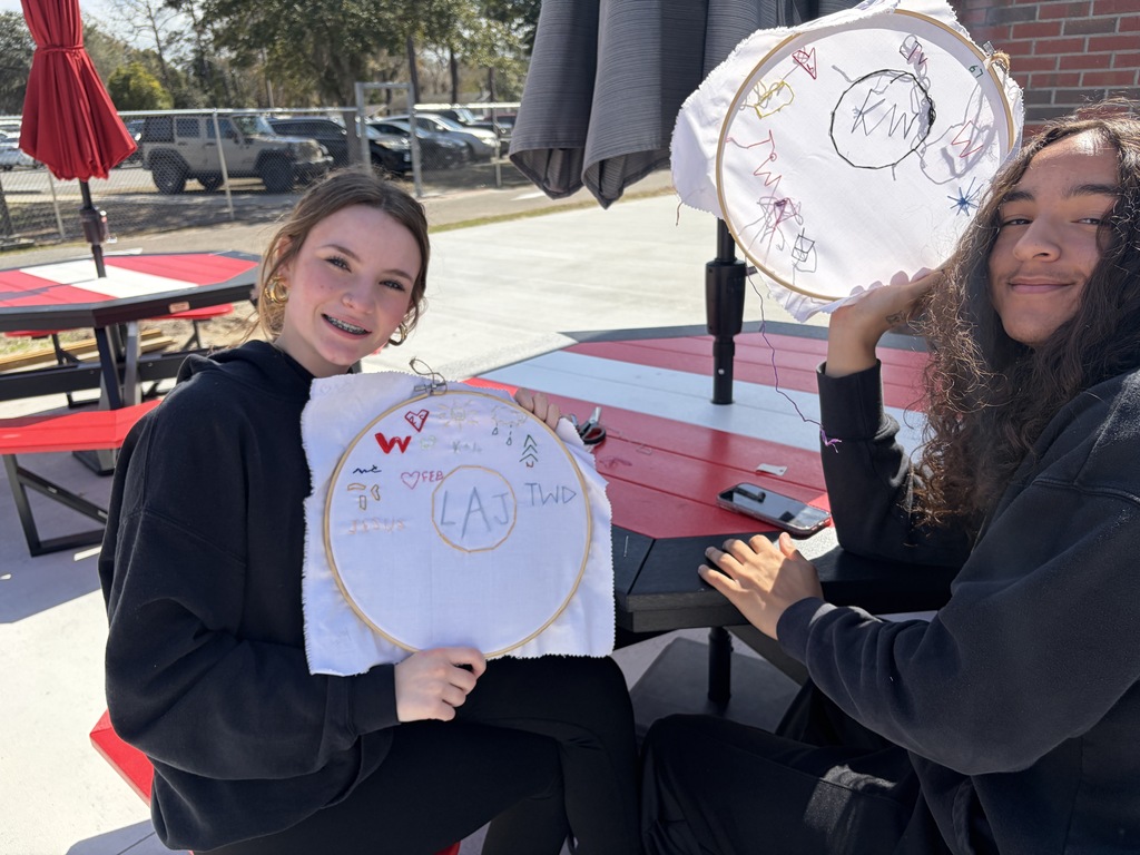 Student working on a hand embroidery memory project.