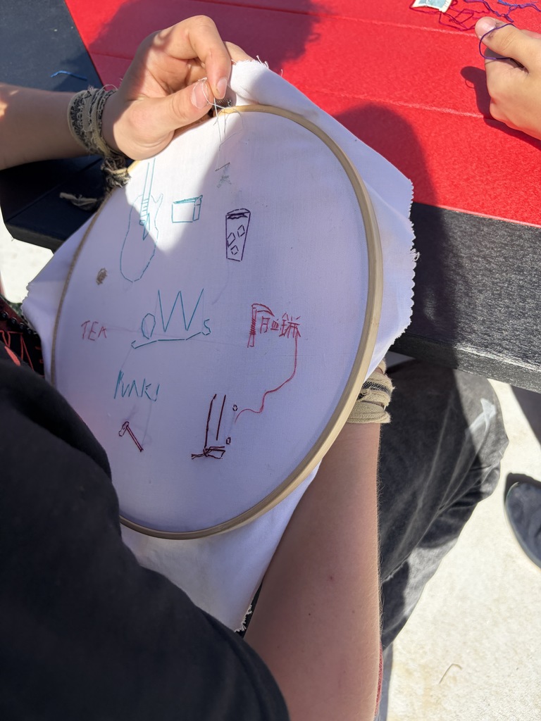 Student working on a hand embroidery memory project.
