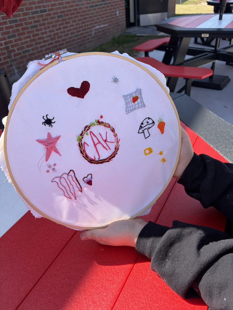 Student working on a hand embroidery memory project.