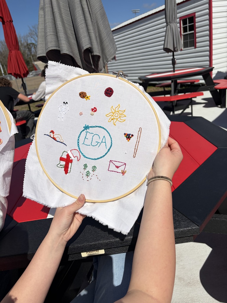 Student working on a hand embroidery memory project.