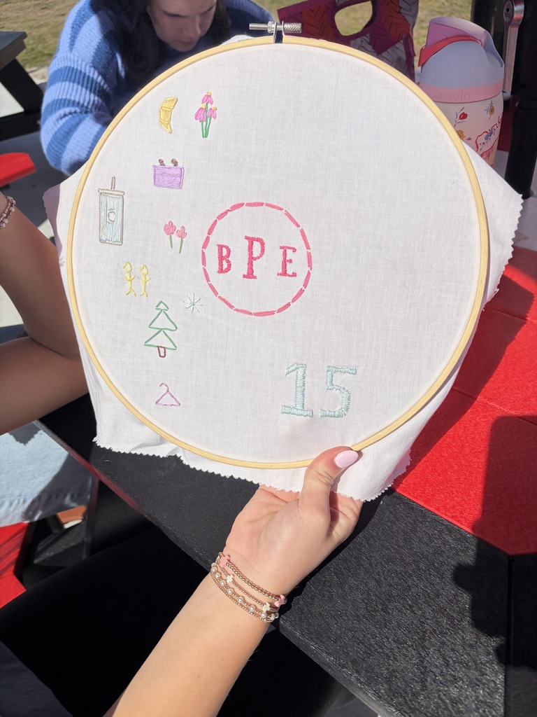 Student working on a hand embroidery memory project.