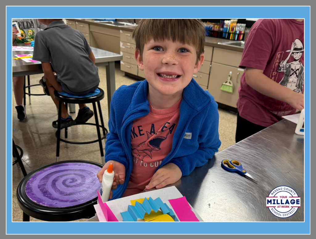 Wildlight Elementary student enjoying a hands-on classroom activity with art supplies.