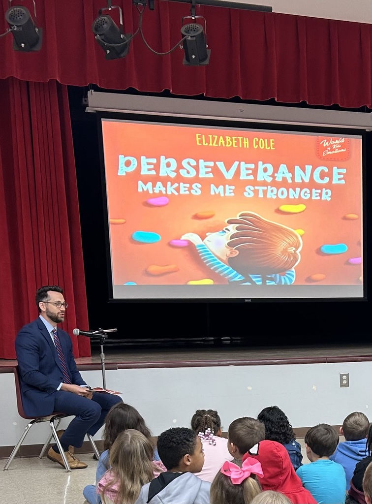 Mr. Cubbal reading to student group