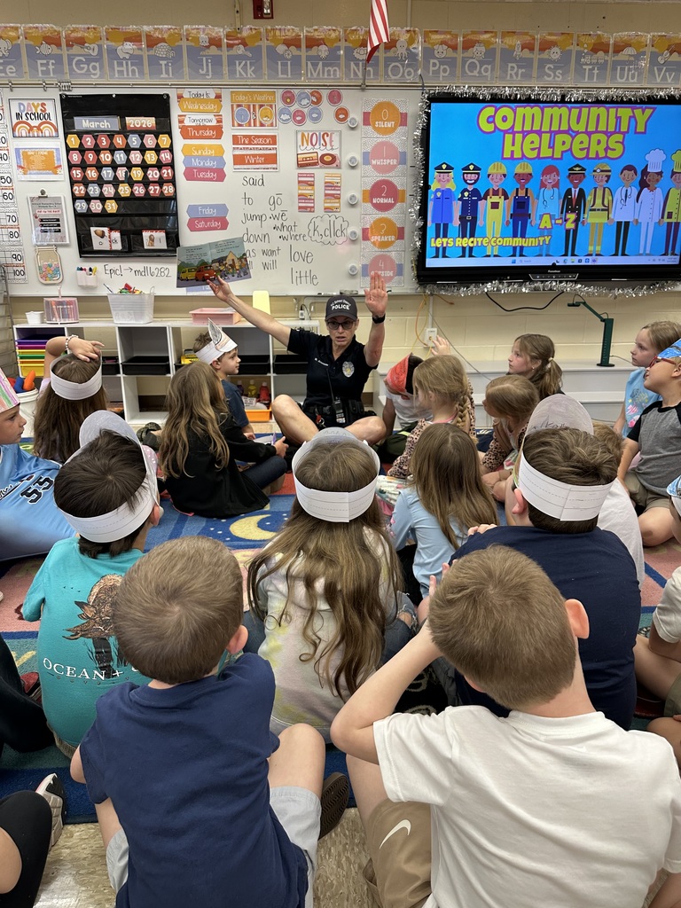 Officer Arseneau reading to student group