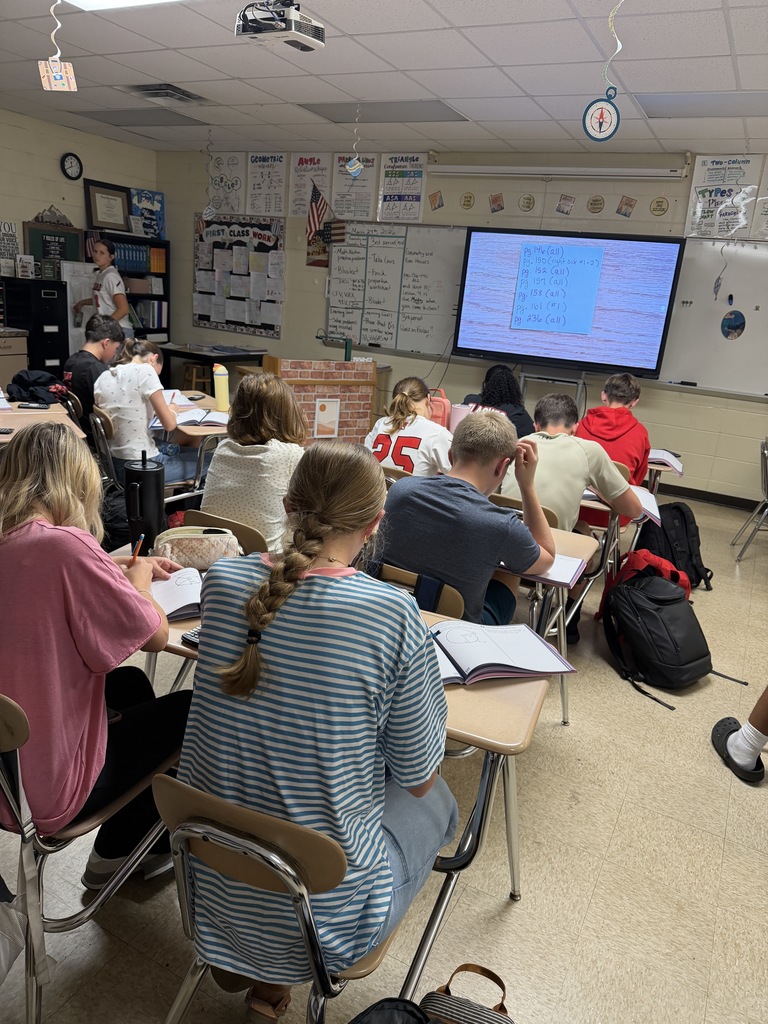 Students working on Geometry problems.