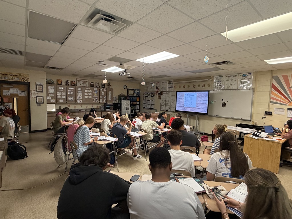 Students working on Geometry problems.