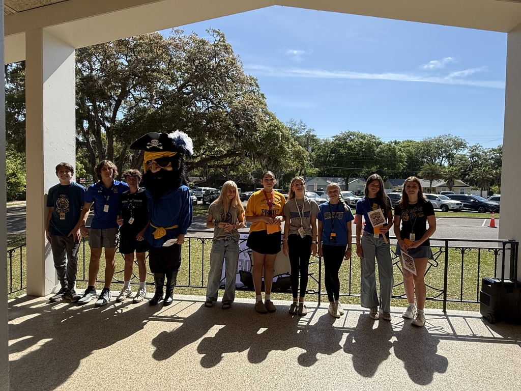 FBMS Student Ambassadors posing with the FBMS mascot.