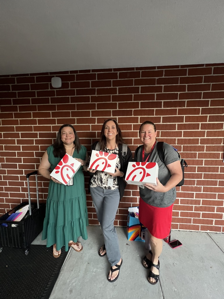 Staff enjoying their Chick-fil-A lunch boxes.