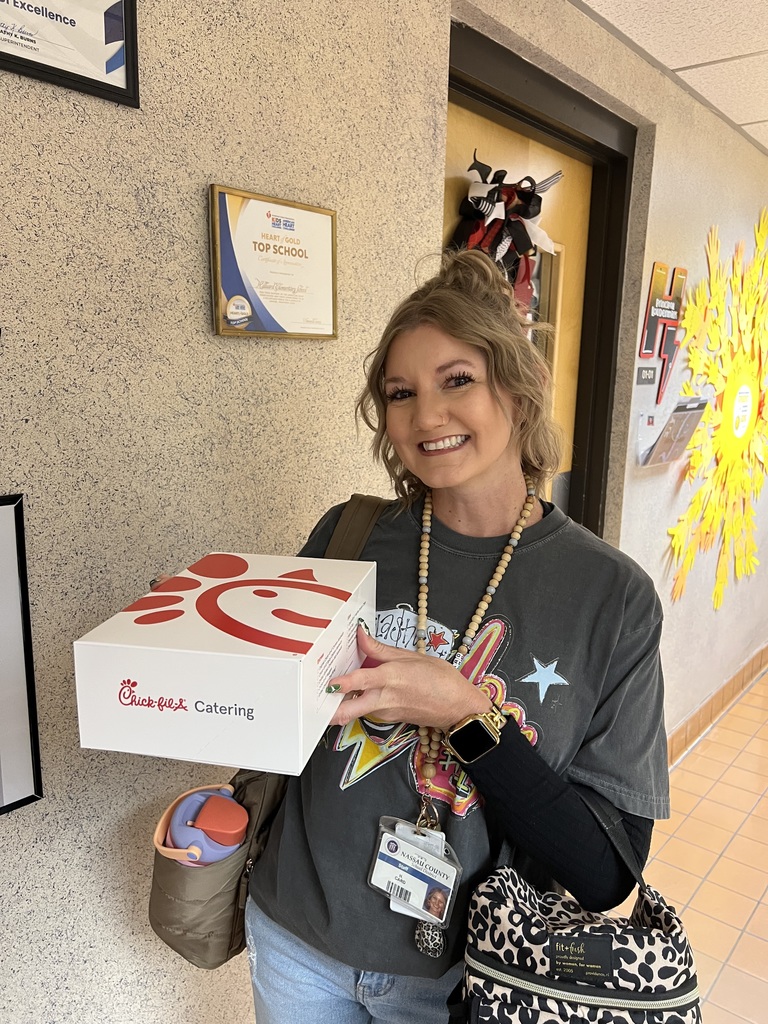 Staff member with their Chick-fil-A boxed lunch. 
