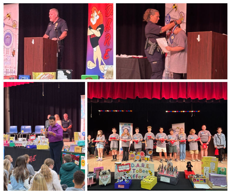 "A collage of four photos on a white background documenting a school event, likely a D.A.R.E. graduation.  Top Left: A law enforcement officer in a dark uniform stands at a wooden podium on a stage, giving a presentation.  Top Right: A close-up of a law enforcement officer placing a graduation medal or ribbon around the neck of a student standing on stage.  Bottom Left: An educator or speaker in a purple shirt addresses a seated audience of students in a gymnasium or auditorium; D.A.R.E. posters and gift bags are visible on the stage behind them.  Bottom Right: A wide shot of a group of approximately ten students standing in a line on stage, holding certificates and trophies. A 'D.A.R.E. To Bee Different' sign and a mascot cutout are displayed in front of them."